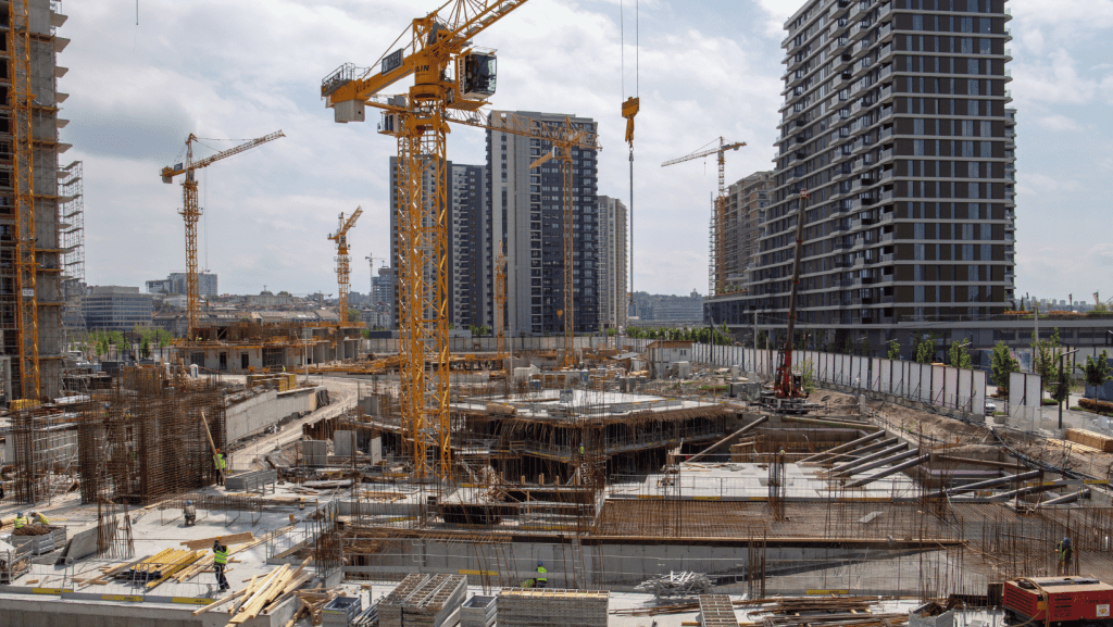 A construction site with cranes and buildings