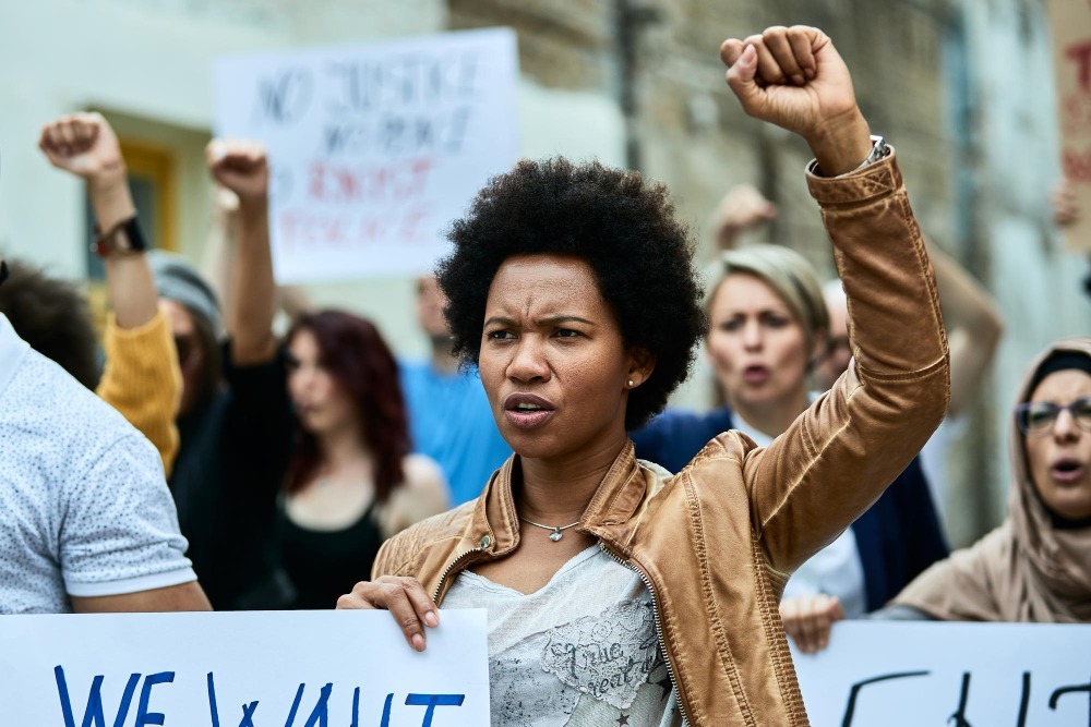 Protesters in south africa demonstrating the dangers of political risk insurance in south africa