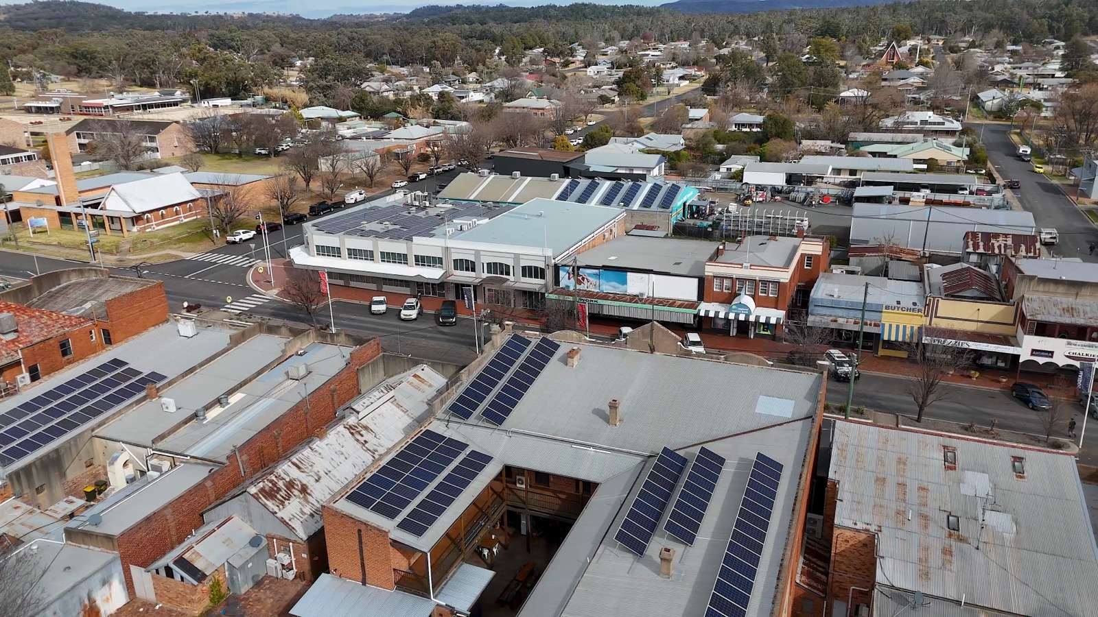 Aerial view of solar panels installed on commercial rooftops — urban renewable energy