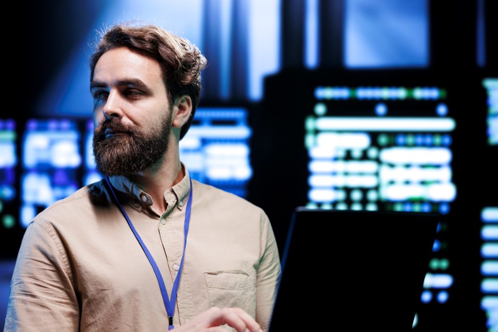 It specialist reviewing server infrastructure — technical response to cyber incidents