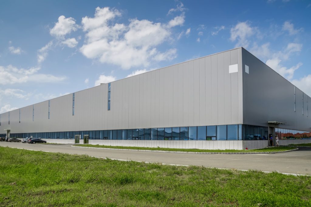 Modern industrial warehouse exterior — commercial property held by south african businesses