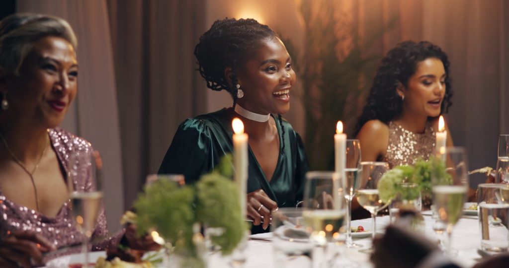 Guests seated at a corporate gala dinner, the kind of year-end function where event liability insurance protects the organiser against third-party claims